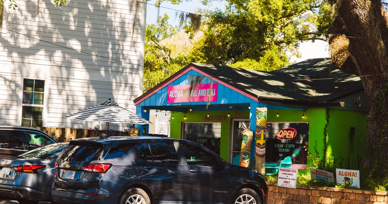 Exterior, restaurant in shadow, parking lot in front