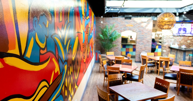 Seating area with a colorful wall mural