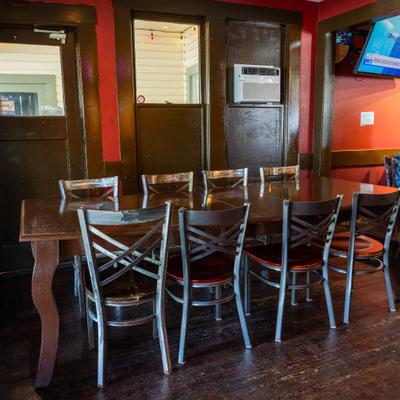Seating place with table and chairs.