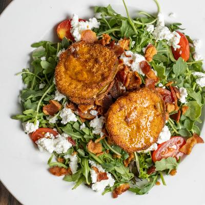 BLT Salad, with fried green tomatoes, arugula, honey, cheese, and ranch dressing.