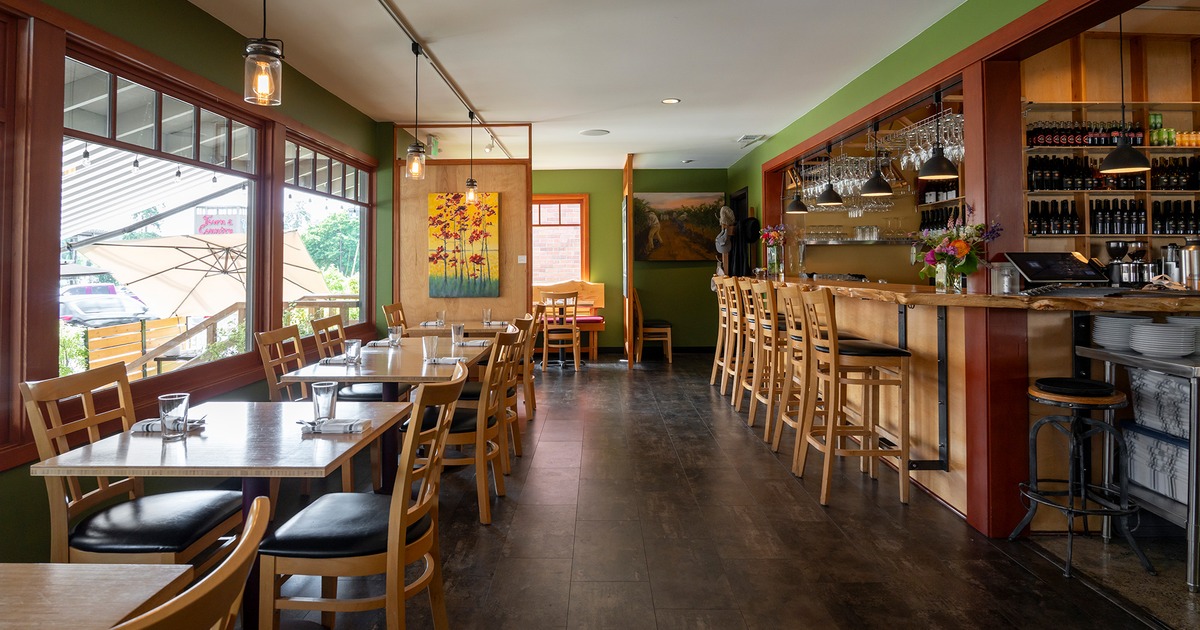Interior, dining area with set tables near the bar