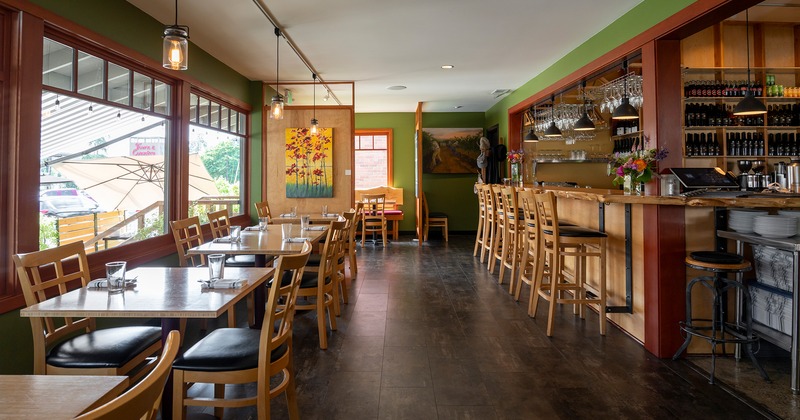 Interior, dining area with set tables near the bar