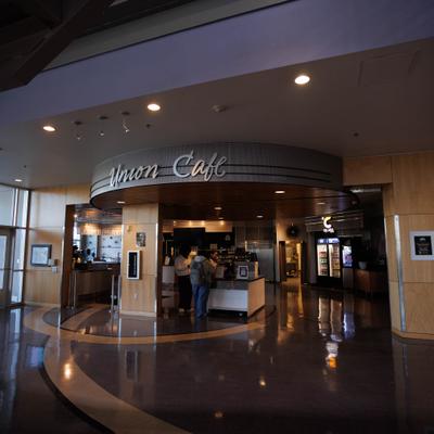 Cafe counter area with signage and staff.
