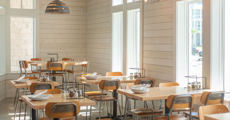 Interior, lined up tables with tableware