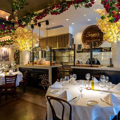 Dining area with fully set round tables.