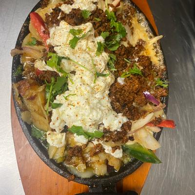A dish served on a wooden plate, top view