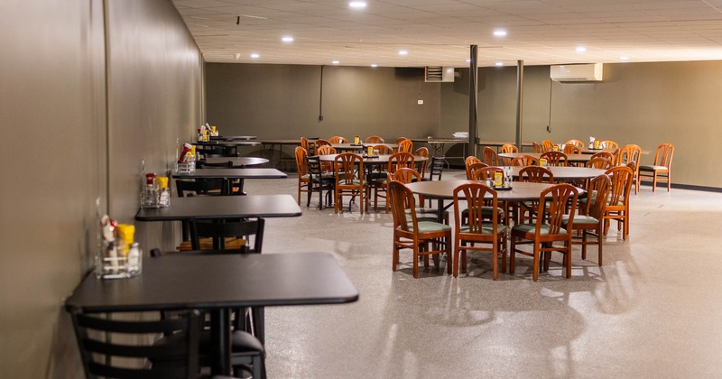 Interior, tables and chairs in seating area