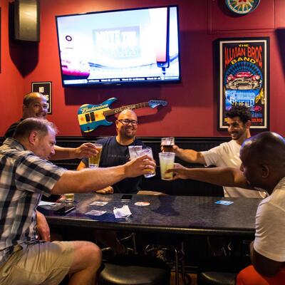 Guests toasting with beer and other drinks