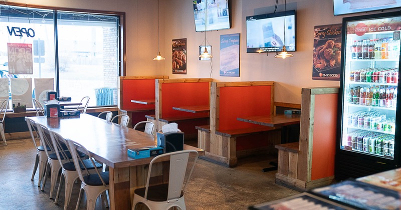 Interior, booth seating and long dining table with chairs
