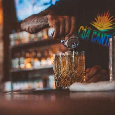 Bartender pouring drinks