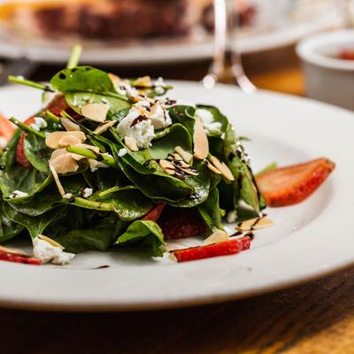 Salad of mixed greens, strawberries, goat cheese, and toasted almonds.