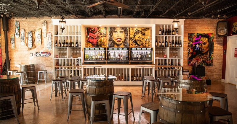 Interior, bar tables and shelves with wine