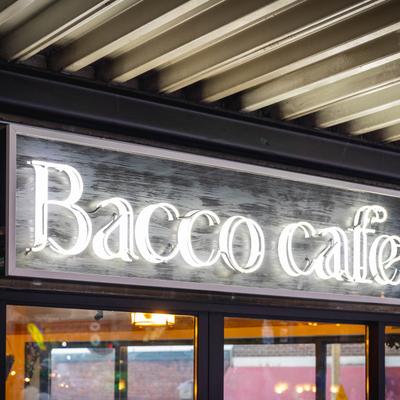 Illuminated neon sign of Bacco Cafe.
