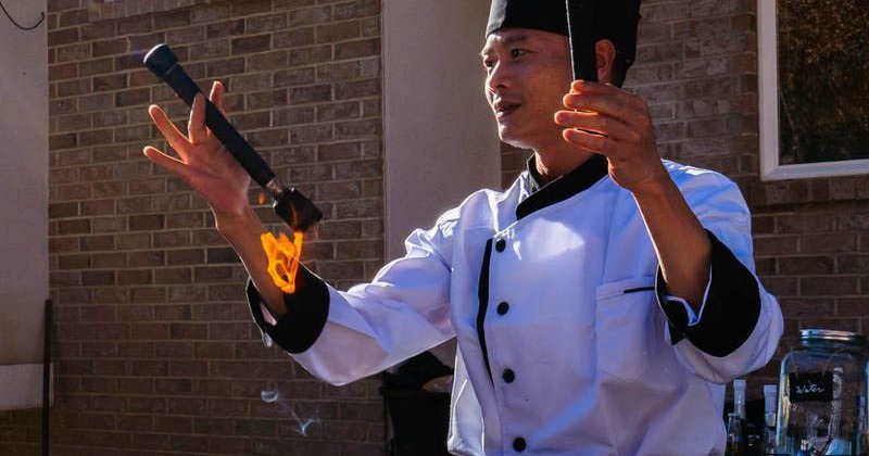 The chef juggling flaming torches