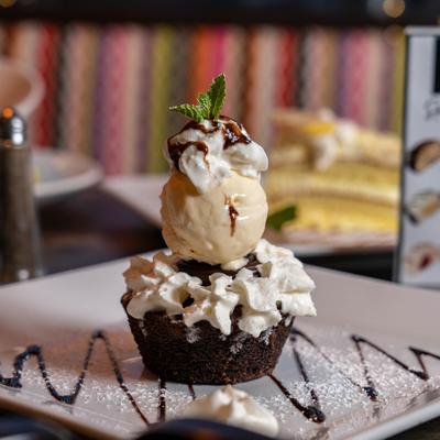 Chocolate lava cake topped with ice cream.