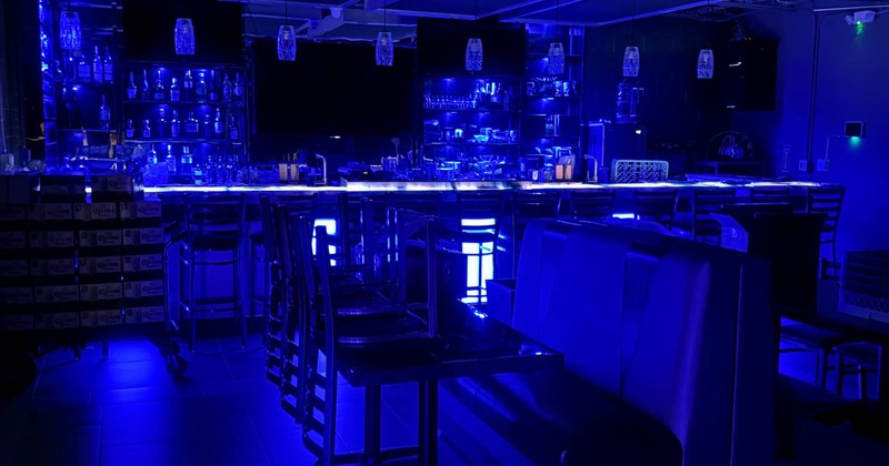 The interior of Bleu Melody with a distinctive blue light theme