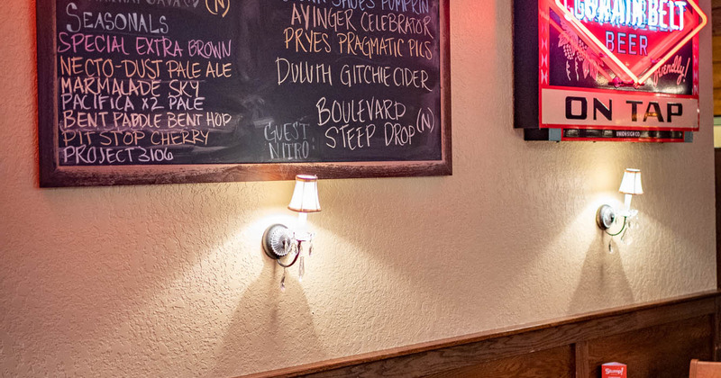 Interior details, lanterns on the wall and a blackboard with menu items