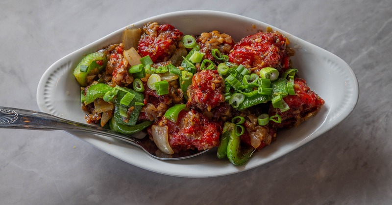 Fried cauliflower florets tossed in a spicy Indo-Chinese sauce