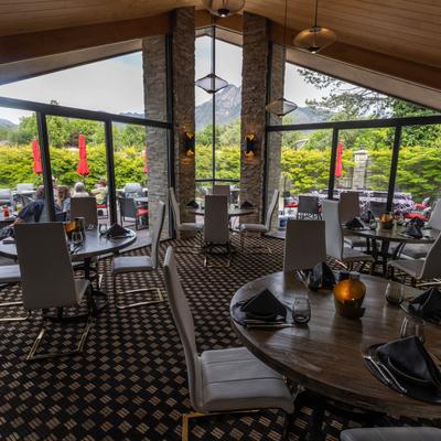Tables and chairs, a view through the windows.