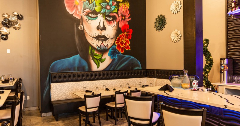 Interior, set tables and seats, large mural art, bar