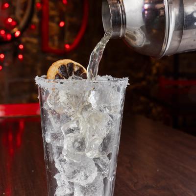 A drink being poured in a glass.