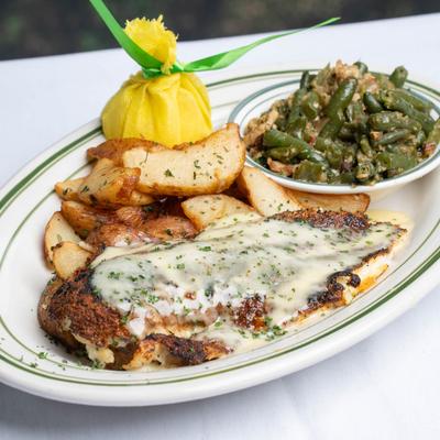 Blackened Redfish topped with Beurre Blanc Sauce served with New Potatoes & Rips Green Beans.