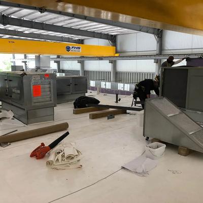 A large warehouse with a lot of equipment in it