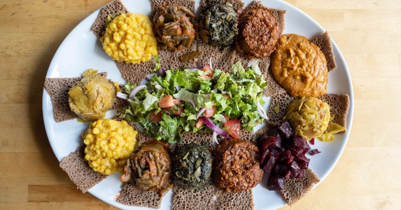 Grilled meat with sauce, salad on the side