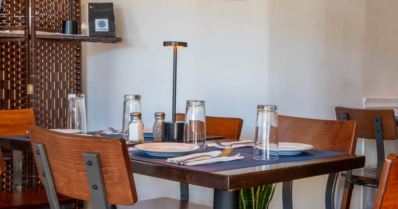 Interior, dining table with chairs ready for guests