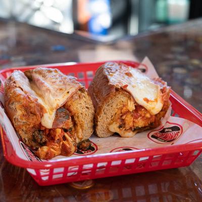 The Godfather Penna Sandwich with chicken, marinara, olives, cheese, and salami.