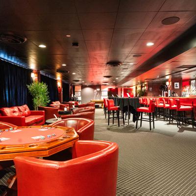 Interior, seating area, leather seats and octagonal wooden table.