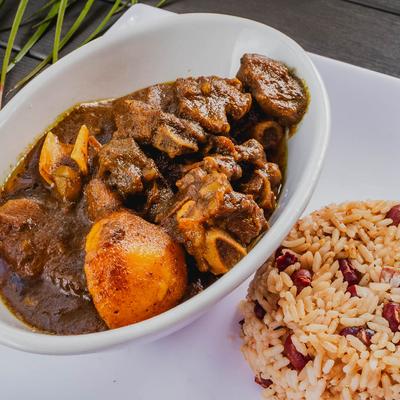Oxtail stew with rice and beans.