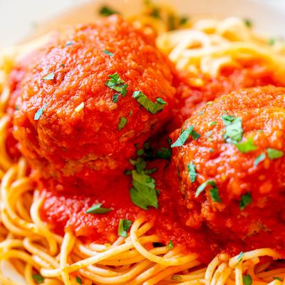 A close up of spaghetti with meatballs.