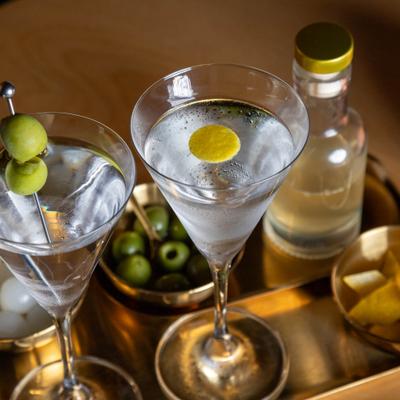 Martini service, two glasses on a tray, top view.