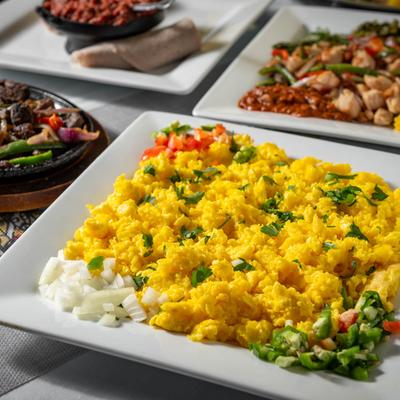 Scrambled eggs with onion, greens peppers, and herb butter.