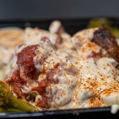 Oxtail smothered in cheese.