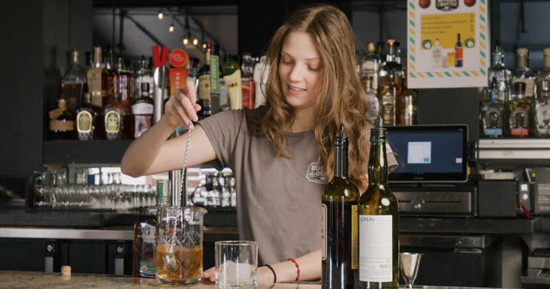 Staff member preparing cocktail