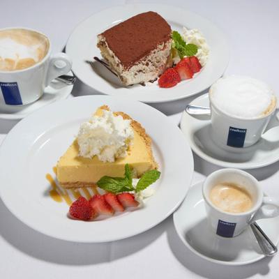Key lime pie and tiramisu served with hot coffee drinks.