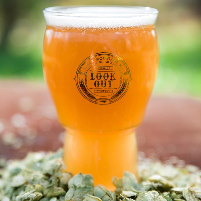 Mountain Hopshine New England IPA served in a branded glass.