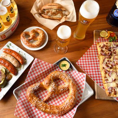 Various food and beer on the table.