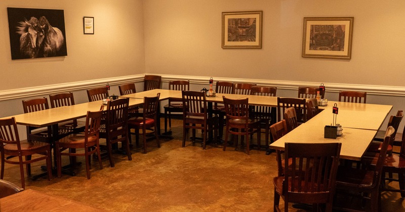 Empty restaurant dining area with arranged tables and chairs