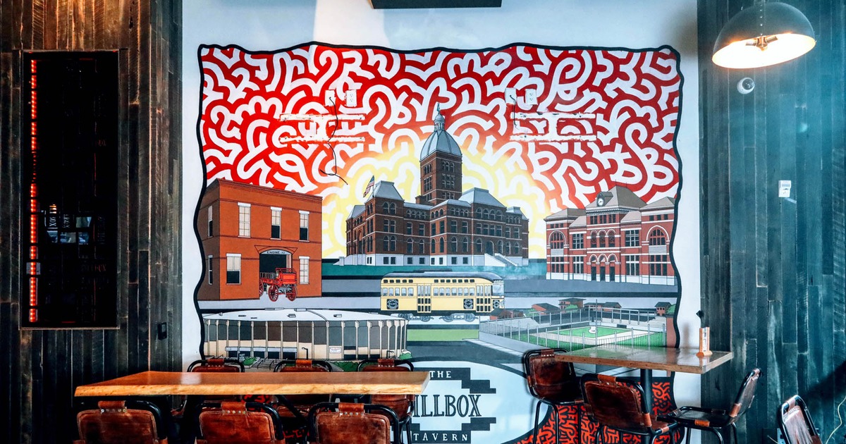 Interior, seating area with a big mural on the wall