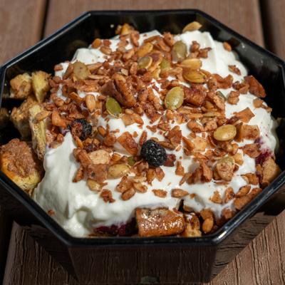 French toast bites with cream,bacon bits, and nuts.