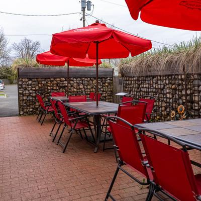 Outside area, tables, chairs, parasols.