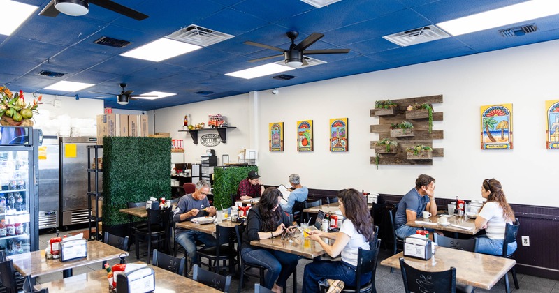 Interior, tables and chairs, guests sitting at the tables