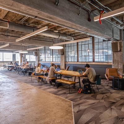 Interior, spacious seating area, long tables and benches.
