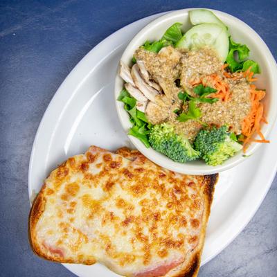 Ham & cheese sandwich and sesame salad with carrots, lettuce, cucumber, broccoli & mushrooms