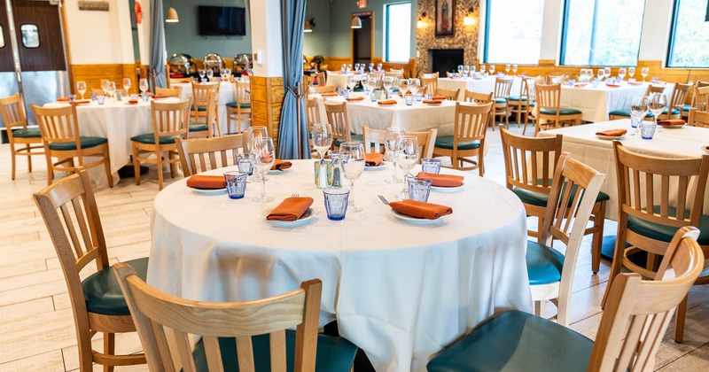 Interior, round table set for guests in dining area