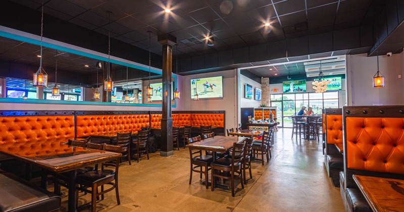 Interior, button tufted seating, tables and restaurant booths