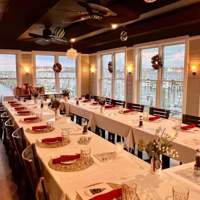 Dining room interior set up for a large event with long banquet tables.